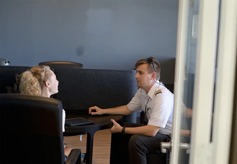 Flight instructor explaining a lesson to a student