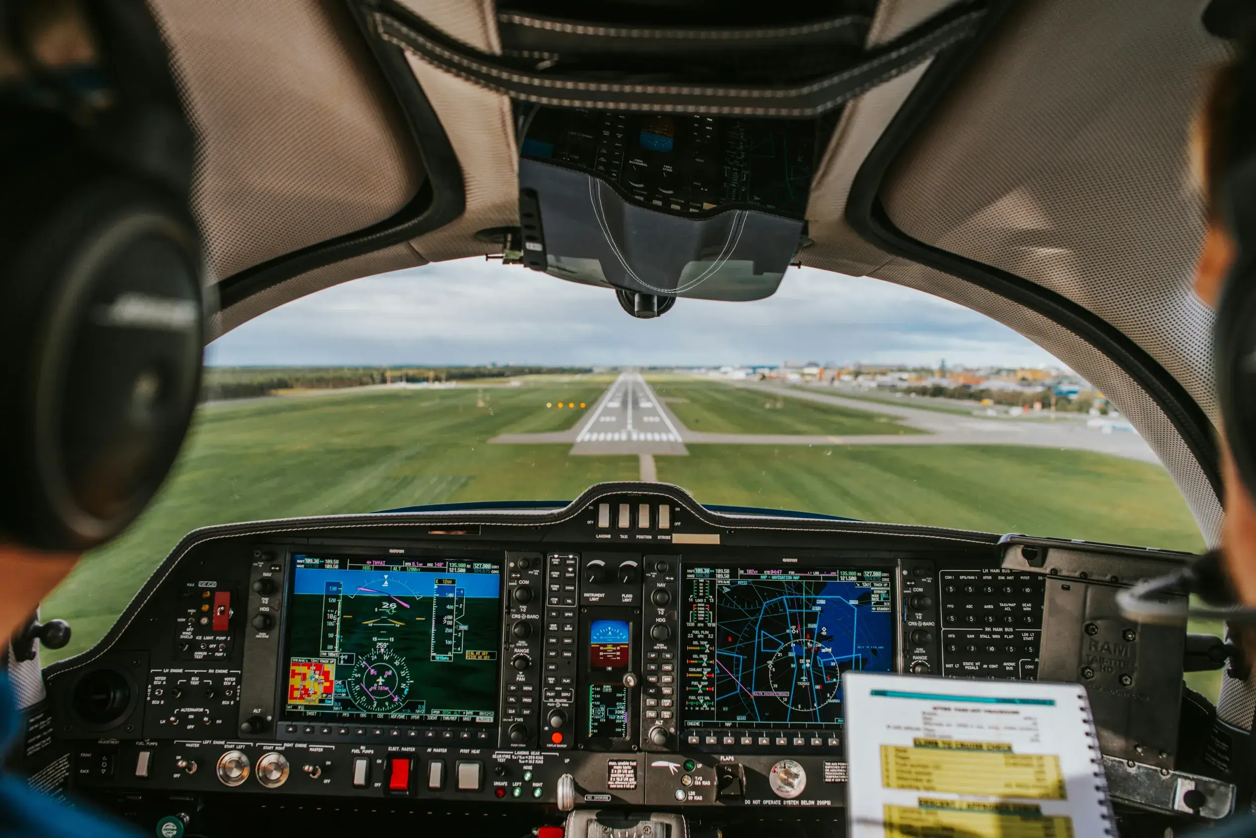 View from inside the cockpit of an aircraft landing on the runway