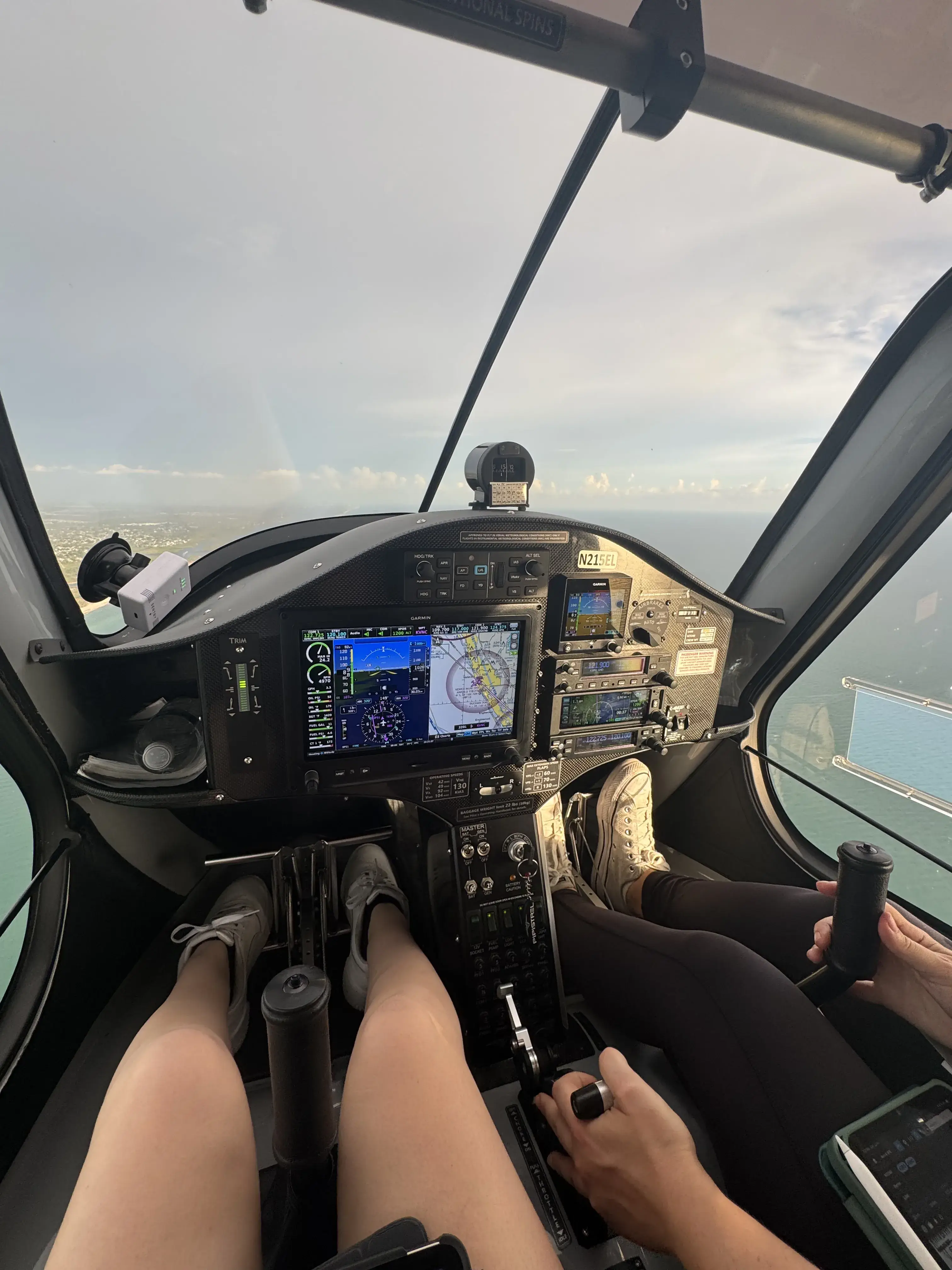 Inside of the cockpit of an airplane with two pilots during flight