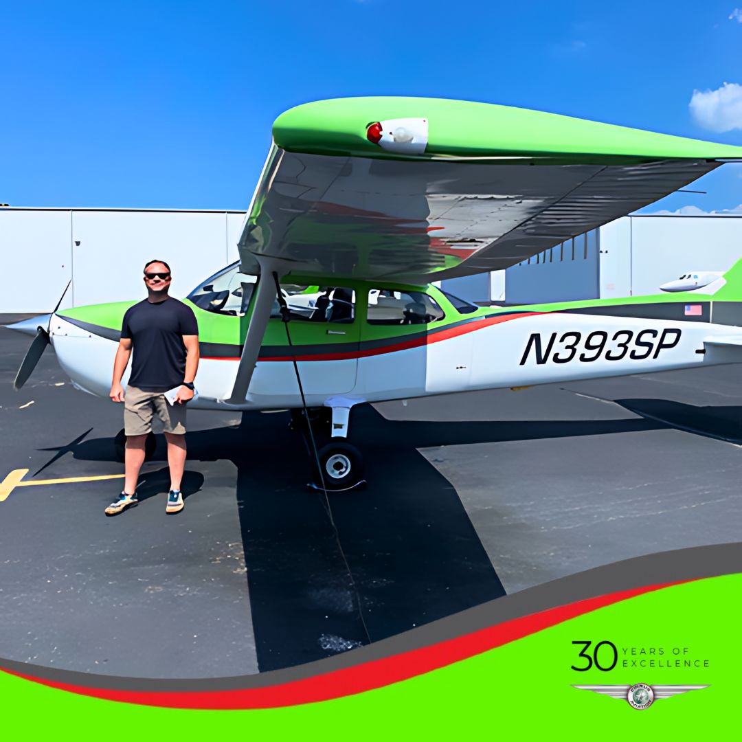 Student standing in front of a Cessna aircraft, Cirrus Aviation watermark at the bottom of the image