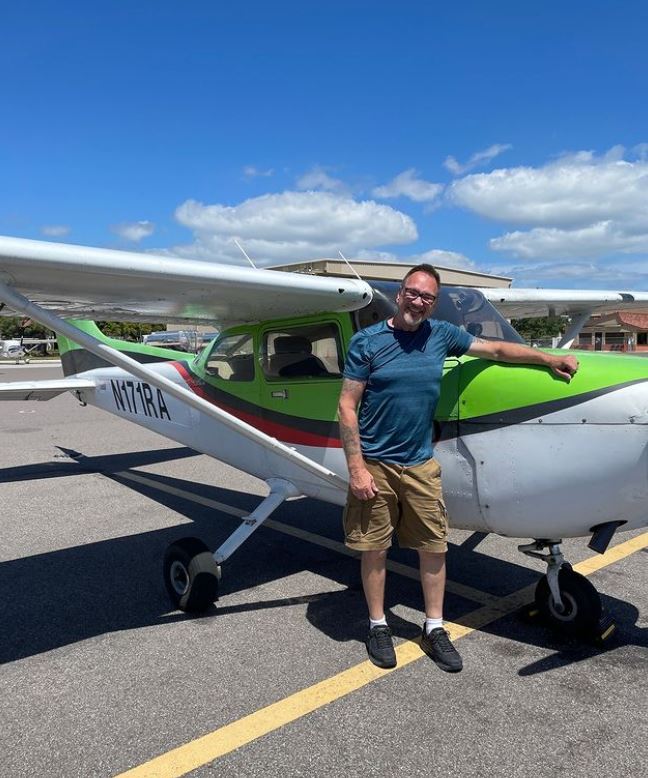 Student in front of a Cessna aircraft