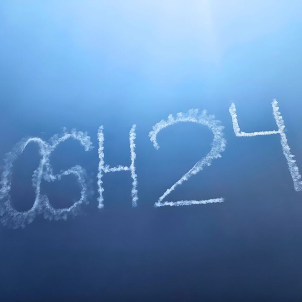 OSH 24 written in the sky with smoke