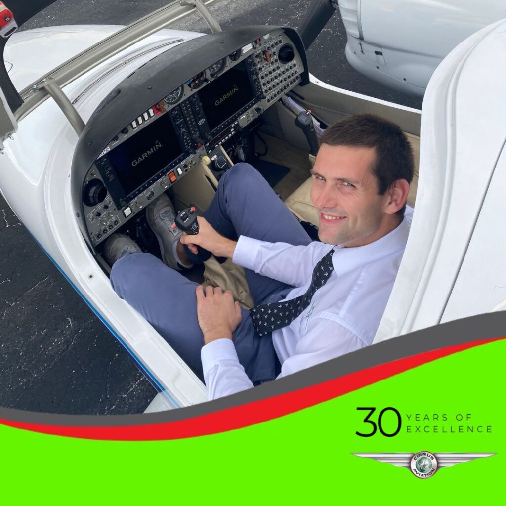 Pilot inside an aircraft cockpit, high angle